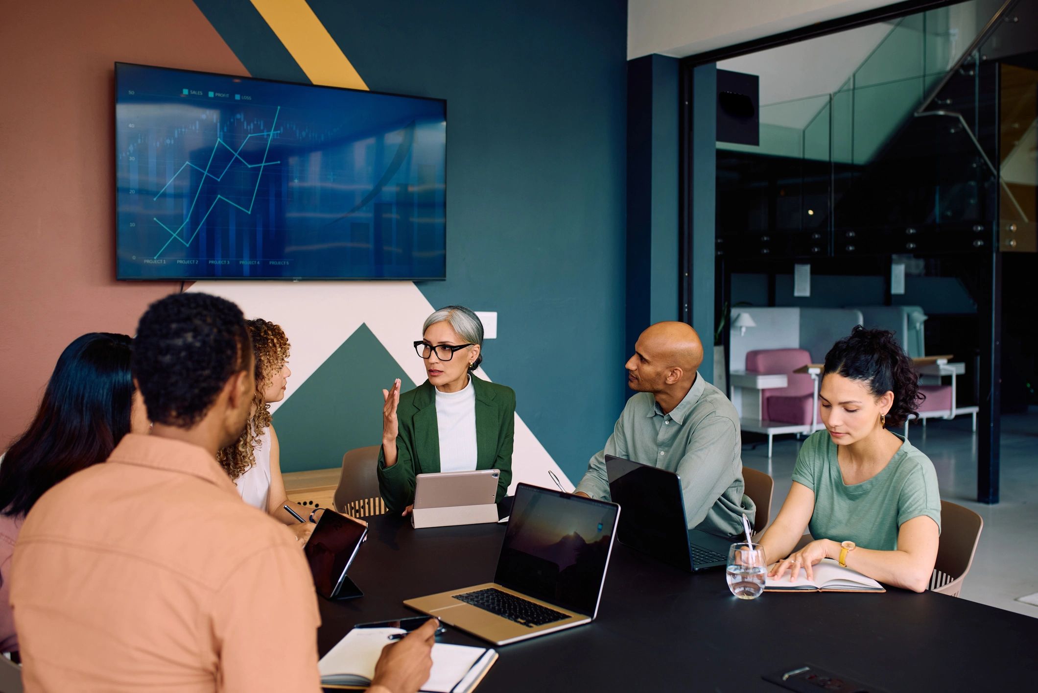 Diverse professionals meeting with a recruiter in a modern office