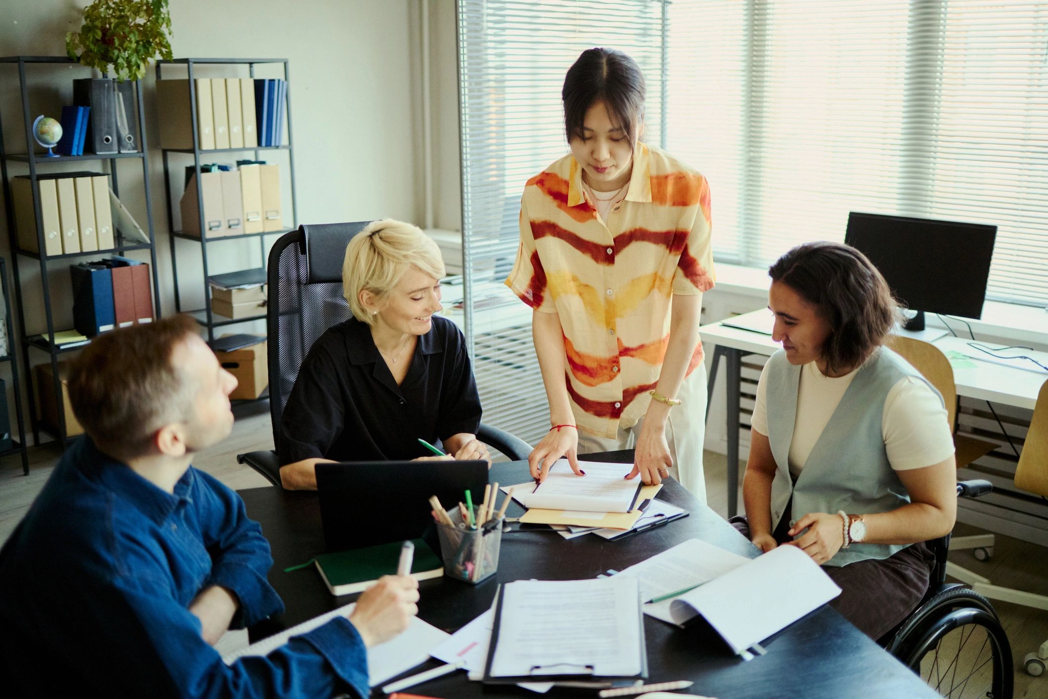Colleagues reviewing documents during a professional development session